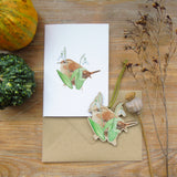 greeting card with wren and snowdrop design and matching wooden decoration 