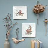 bullfinch wall art tile hung in a gallery wall with another design in the collection