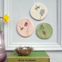 handmade ceramic butterfly and sweet pea plaque